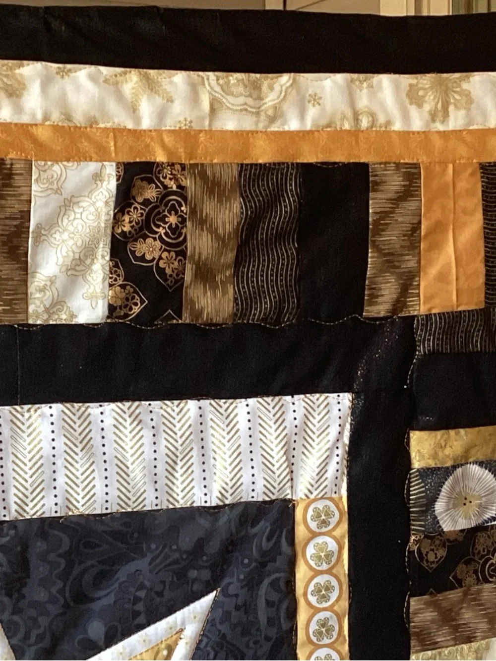 NWT. Gold and Black Star Lap Quilt